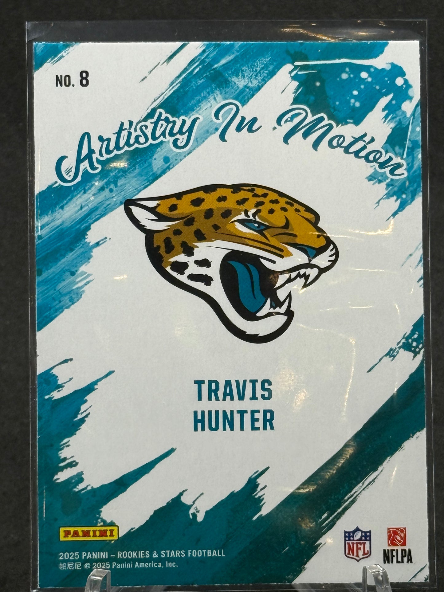Travis Hunter Jacksonville Jaguars RC ARTISTRY IN MOTION 2025 Panini card